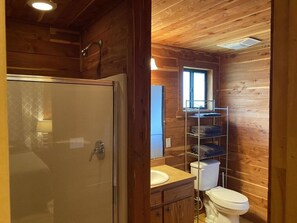 Shower, hair dryer, towels, toilet paper