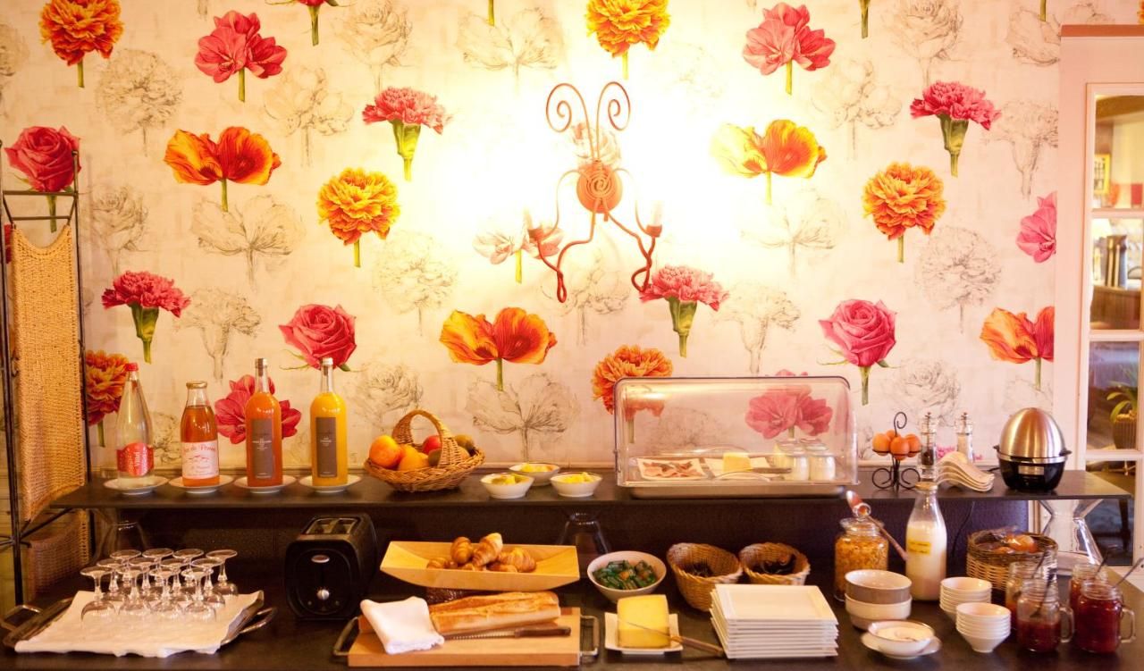 A breakfast buffet with various food items and beverages.