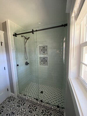 Shower, hair dryer, towels, soap