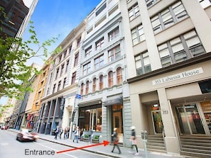 Located at 353 Labassa House, this classic building features a mix of storefronts and a main entrance.