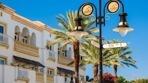 Street lamps with signs indicating '5th Ave S' and 'Avenue South'. - Bayfront Duplex! Gulf Access w/ Dock, Pool, Bikes, Kayak & Over $100 of Free Daily Activities! (Bonita Springs)