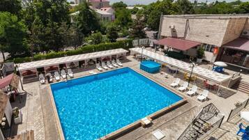 Seasonal outdoor pool, open 10:00 AM to 9:30 PM, free pool cabanas