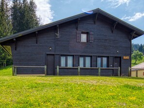 A wooden building with a sloped roof, a small window, and a sign that reads 'POYA'. - Chalet on the slopes with sauna and terrace, sleeps 12 (Morillon 1100)
