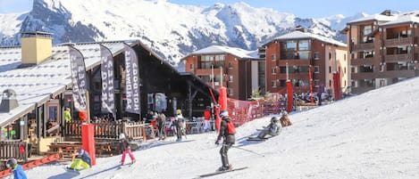 A ski resort with a restaurant and a ski lift area.