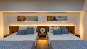 A double room with two beds, each with patterned bedding and headboards. There are two wall-mounted paintings above the beds. - 🌿🌿 Tamarind 4 (Durango)