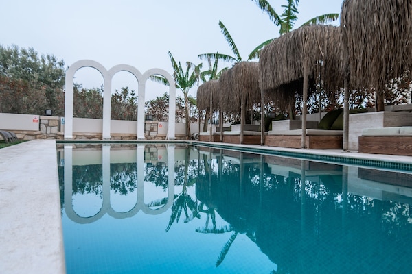 Outdoor pool, pool umbrellas, sun loungers