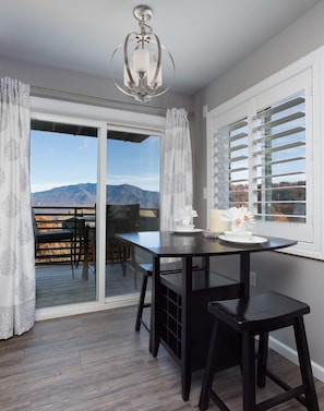 Enjoy a serene mountain view from the deck, where you can relax with a cup of coffee at the table and chairs.