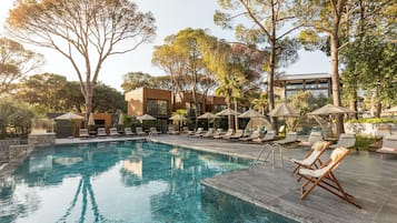 Outdoor pool, open 7:30 AM to 7:00 PM, pool umbrellas, pool loungers