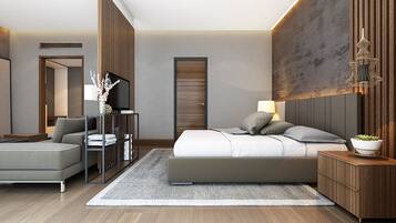 A modern bedroom with a bed, bedside table, lamp, and a TV on a stand.