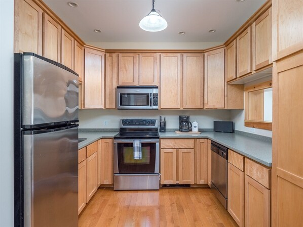 Enjoy cooking in this well-equipped kitchen with a refrigerator, microwave, and coffee maker.