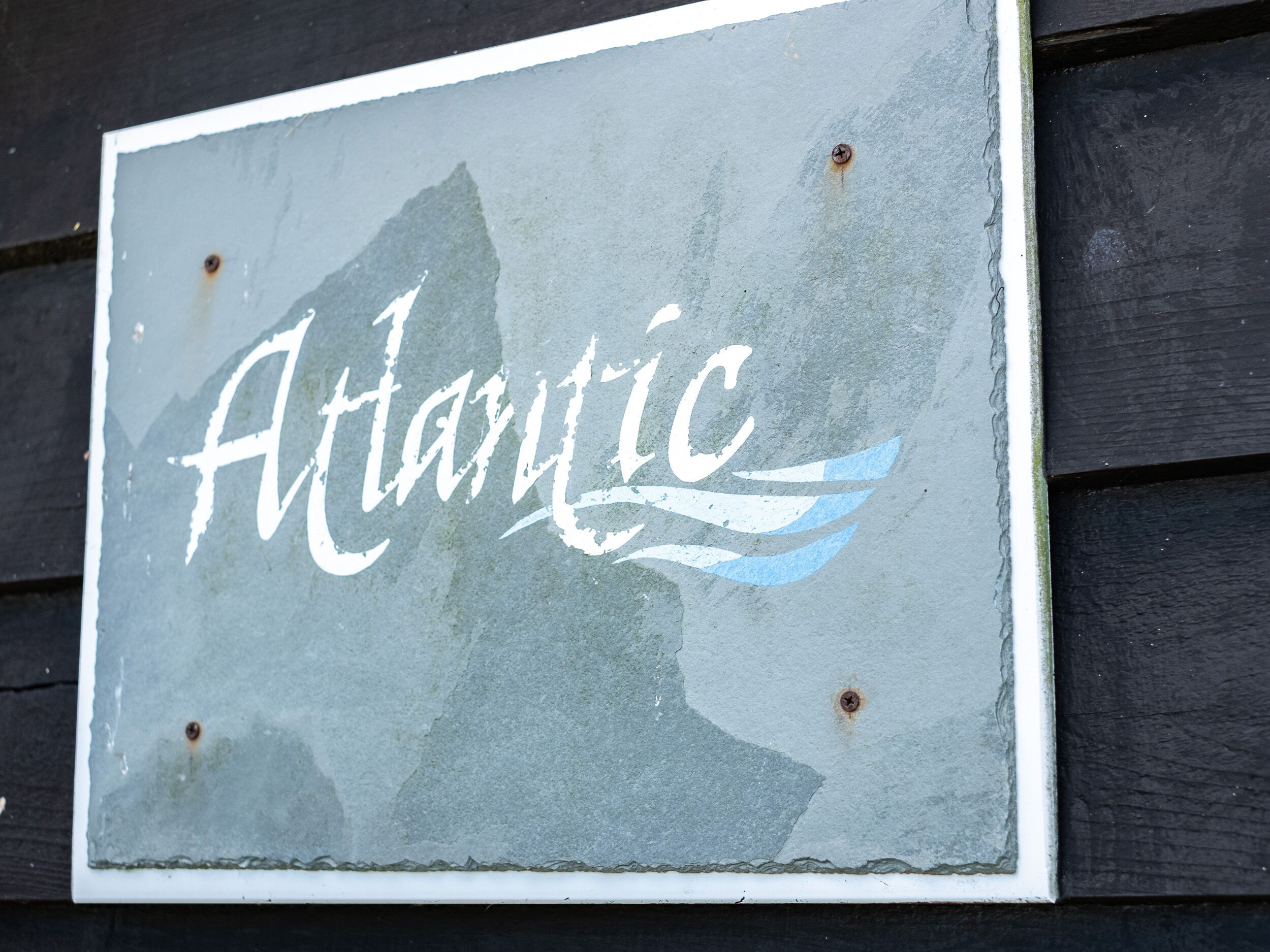 A sign with the word "Atlantic" and a stylized wave design.