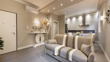Deluxe Apartment, 1 Bedroom | Living area | Flat-screen TV
