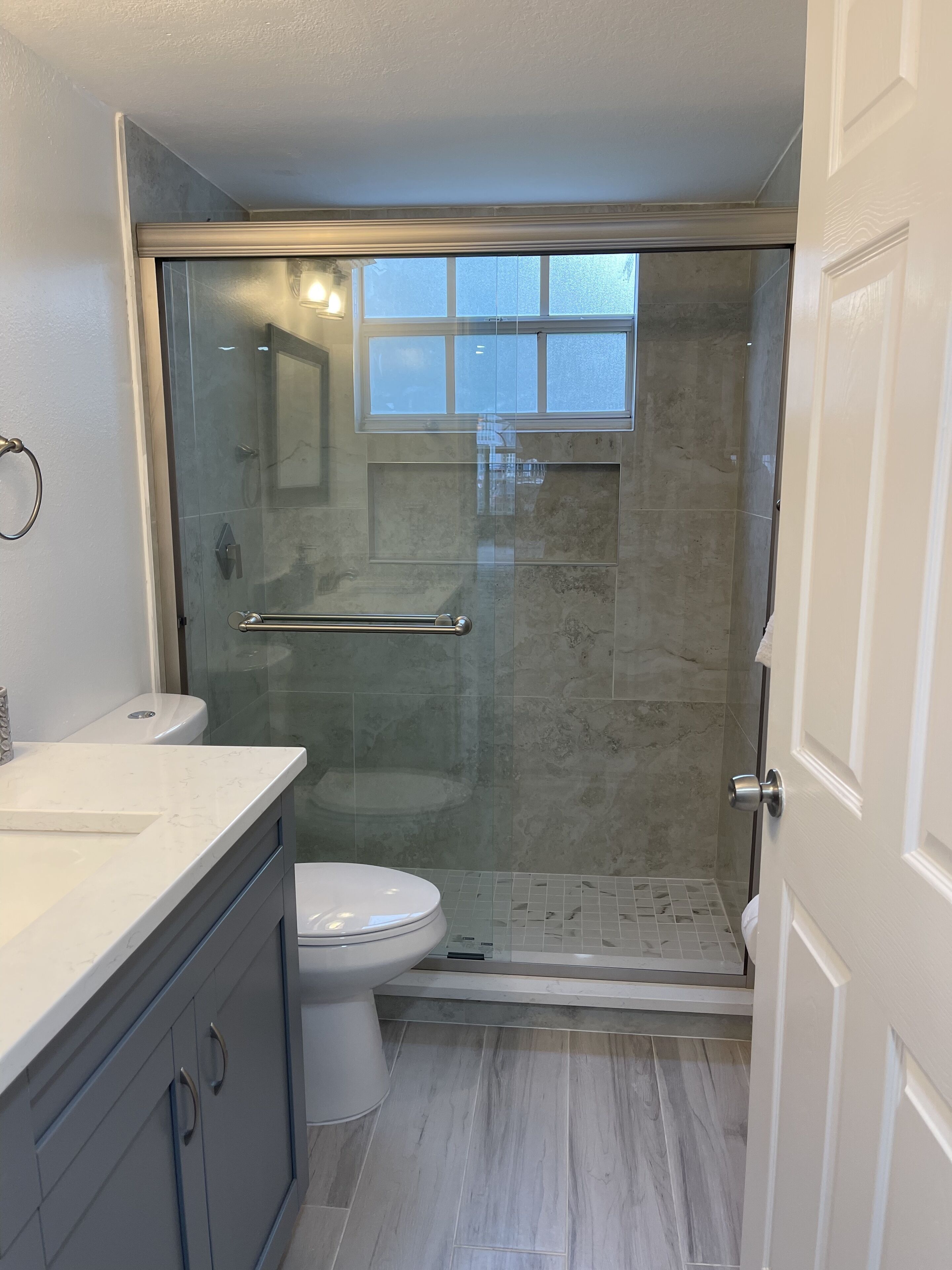 Shower, hair dryer, towels, toilet paper