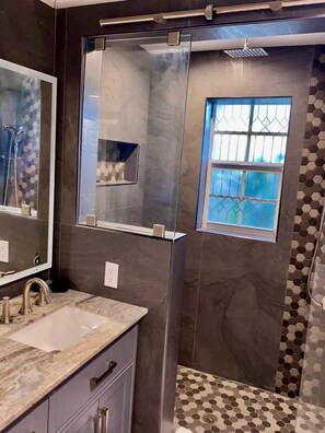 Shower, hair dryer, towels, soap