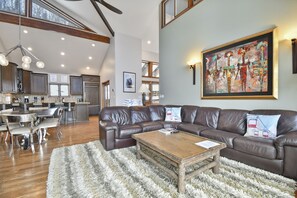 Deluxe Townhome | Living area | 60-inch flat-screen TV with cable channels, fireplace, Netflix
