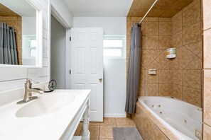 Combined shower/tub, jetted tub, rainfall showerhead, soap