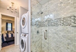 Combined shower/bathtub, hair dryer, towels, toilet paper