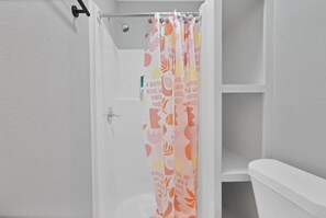 Combined shower/tub, hair dryer, towels, soap
