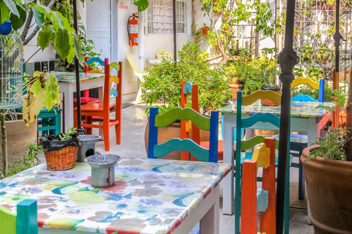 breakfast table with eggs, coffee, bread, fruits-Casa de Don Pablo Hostel's breakfast for guests 