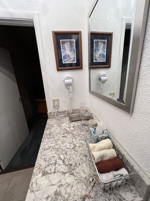 Combined shower/bathtub, jetted bath, hair dryer, heated floors