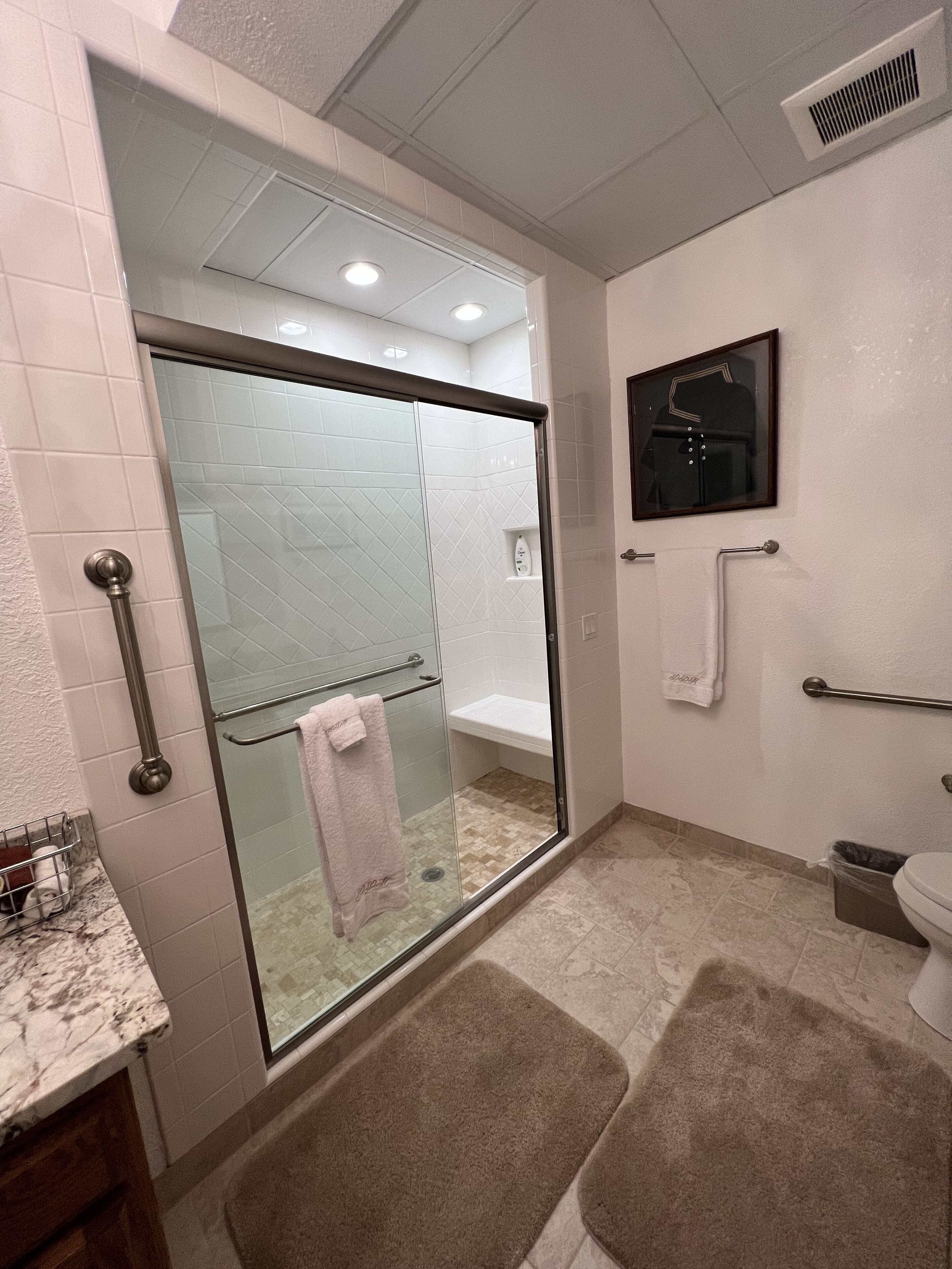 Combined shower/tub, jetted tub, hair dryer, heated floors