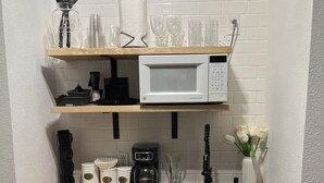 A compact kitchen with a microwave, coffee maker, and a sink. - Branson, Stone Bridge Resort Studio (Reeds Spring)