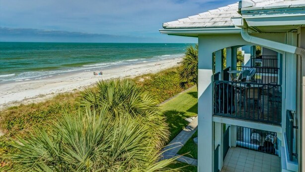 A beachfront property with a balcony overlooking the ocean. - Class A Condo - located in Belleair Beach, FL (Belleair Beach)