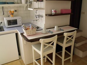 Fridge, microwave, coffee/tea maker, dining tables