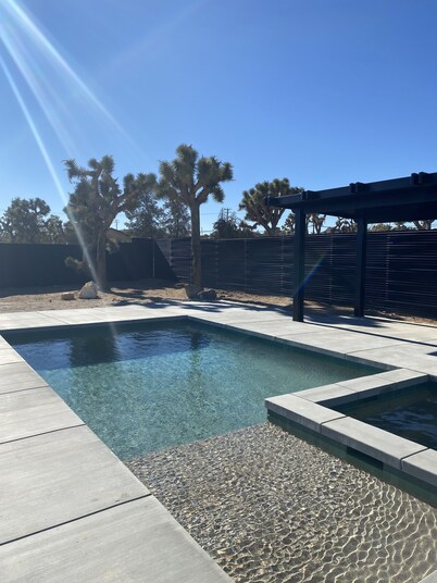 A gorgeous 3bd cabin + pool with gorgeous views surrounded by joshua trees