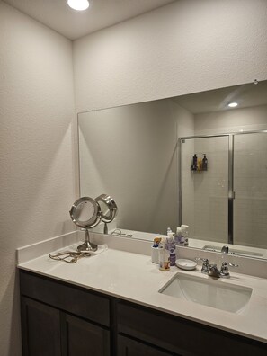 Bathtub, towels, soap, shampoo