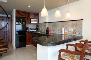Fridge, microwave, stovetop, coffee/tea maker