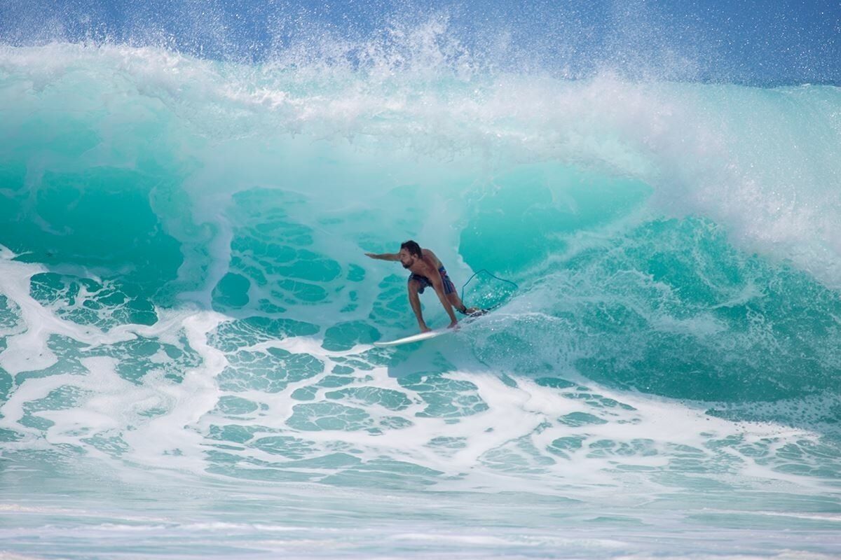 A person surfing a wave.