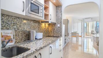 Fridge, microwave, stovetop, coffee/tea maker