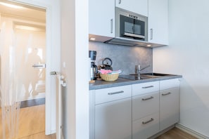Fridge, microwave, dishwasher, coffee/tea maker