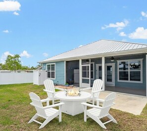 Outdoor dining - Coastal Escape: 3BR + Pet-Friendly + Golf Cart! (Panama City Beach)