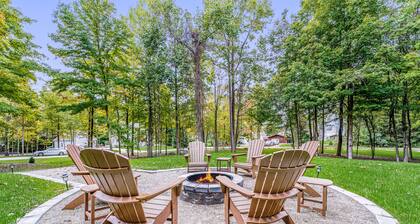 Lakeview home with beach access, private pickleball court, firepits & fireplace