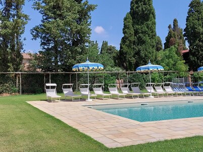 Lovely flat with private covered terrace, pool, large shared garden.