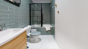 Bathtub, hair dryer, towels