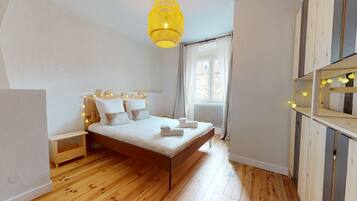 2 dormitorios, tabla de planchar con plancha, wifi gratis y ropa de cama