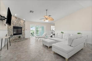 Smart TV, fireplace, books, offices