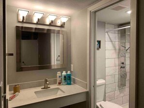 Combined shower/bathtub, hair dryer, towels, soap