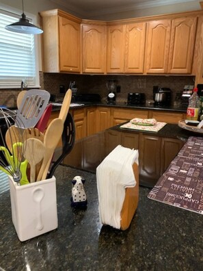 Microwave, dishwasher, coffee/tea maker, cookware/dishes/utensils