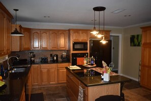 Microwave, dishwasher, coffee/tea maker, cookware/dishes/utensils