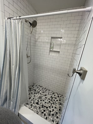 Shower, towels, soap, toilet paper
