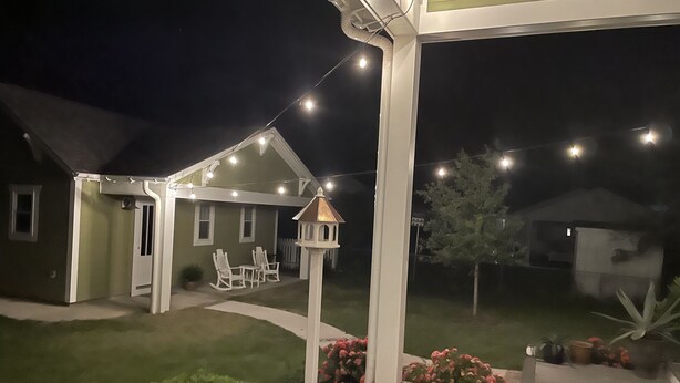 A house with a covered patio area, string lights, and outdoor seating. - Walking distance to Downtown Beaufort, NC. Short drive to several beaches. (Beaufort)