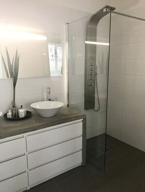 Shower, towels, soap, toilet paper