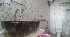 Shower, hair dryer, soap, toilet paper