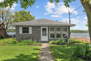 A single-story house with a front door, windows, and a number '3780' on the side. - Sunset Sanctuary: "Picture Perfect Sunsets on Canandaigua Lake!" (Canandaigua)