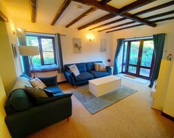Cottage | Living area | 30-inch TV with cable channels
