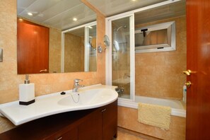 Bathtub, hair dryer, towels